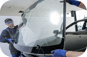 Technician preparing a windscreen repair