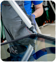 Technician replacing a windscreen