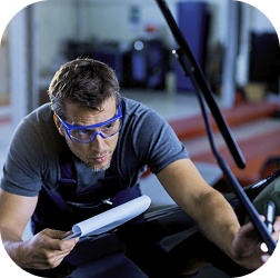 Technician inspecting a vehicle