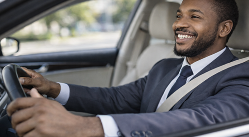 Happy customer driving after windscreen service